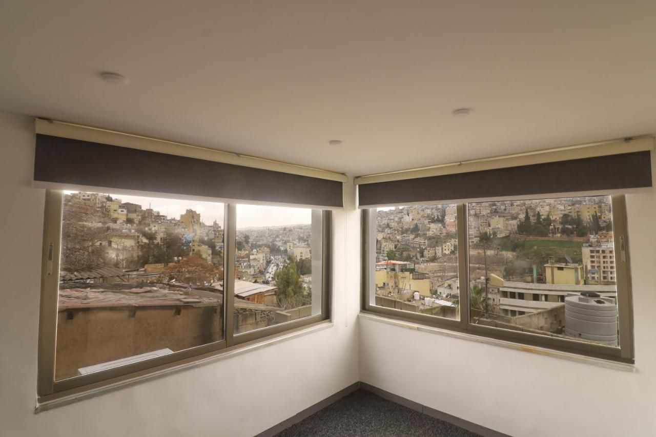 Corner room with panoramic windows over Amman