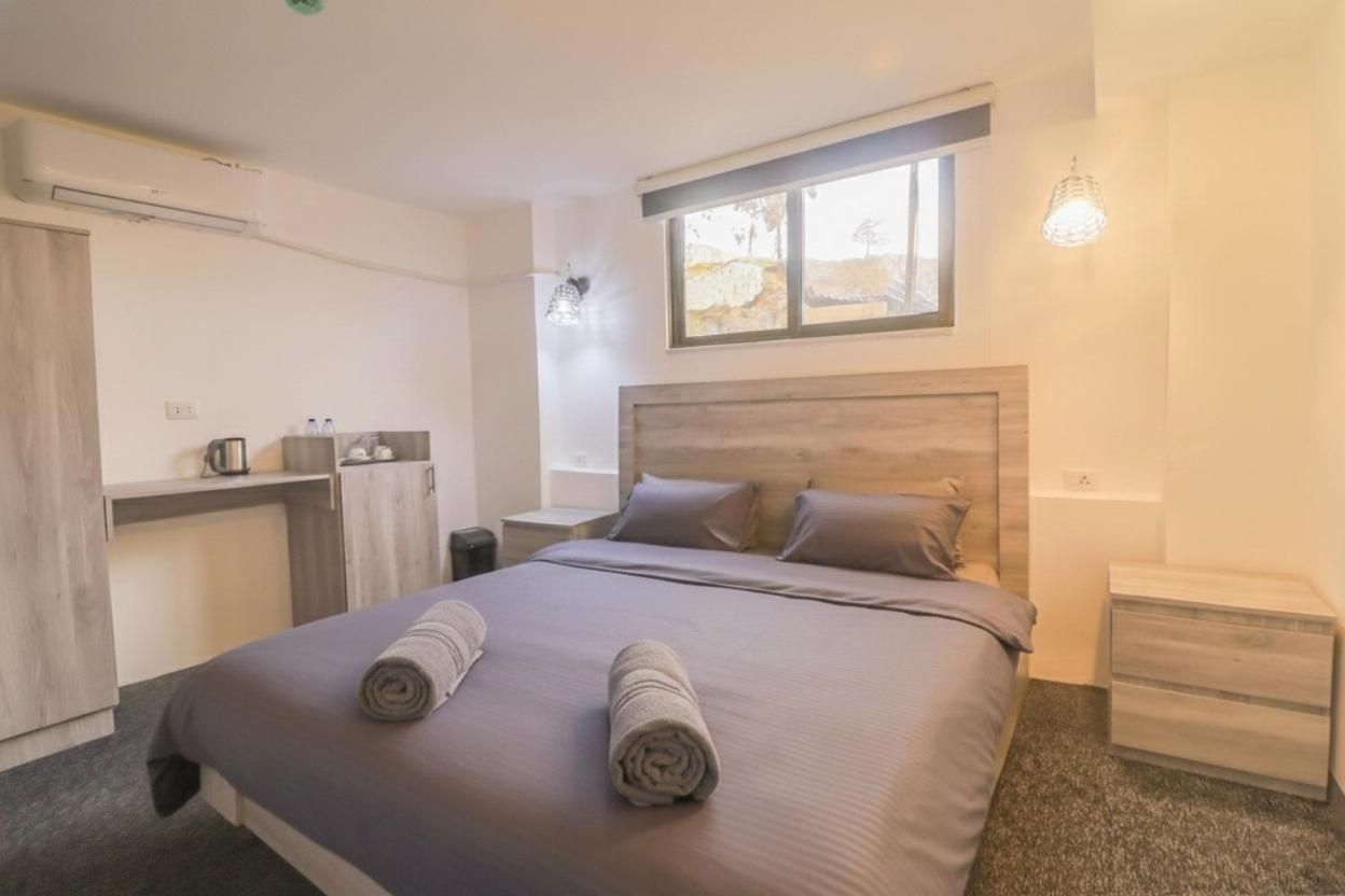 Double room with large bed and city window