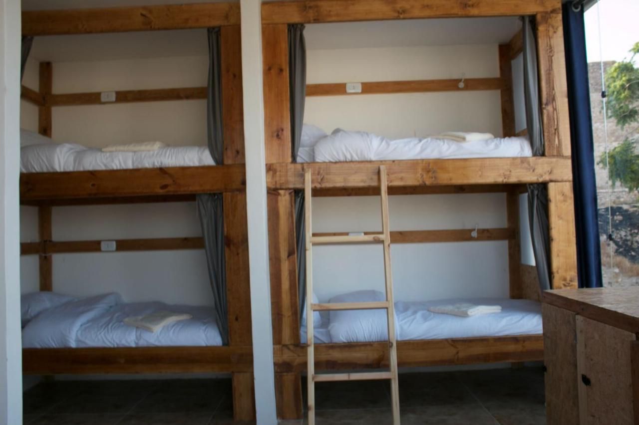 Mixed dorm with handmade wooden bunks