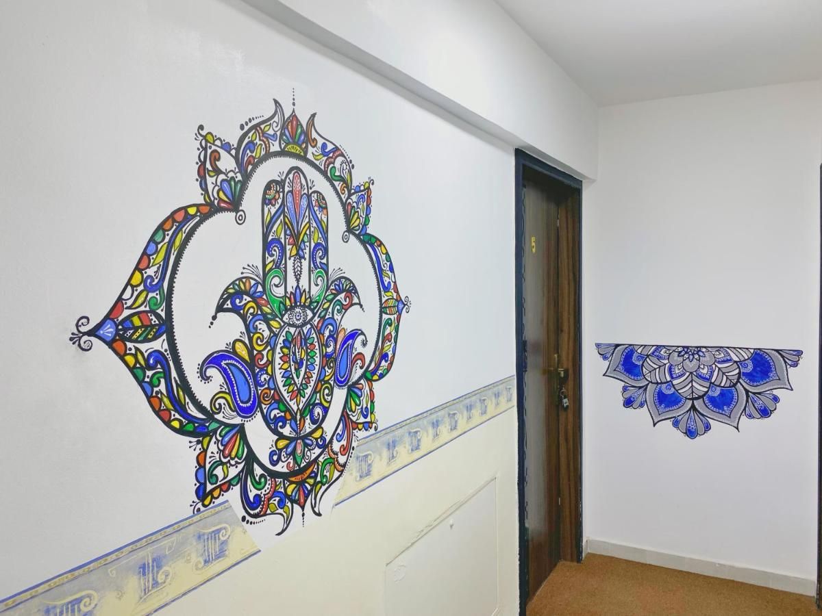 Hand-painted hamsa mural
