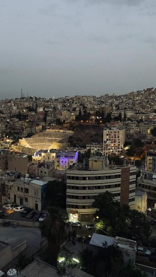 Night view over the lit Roman Theatre
