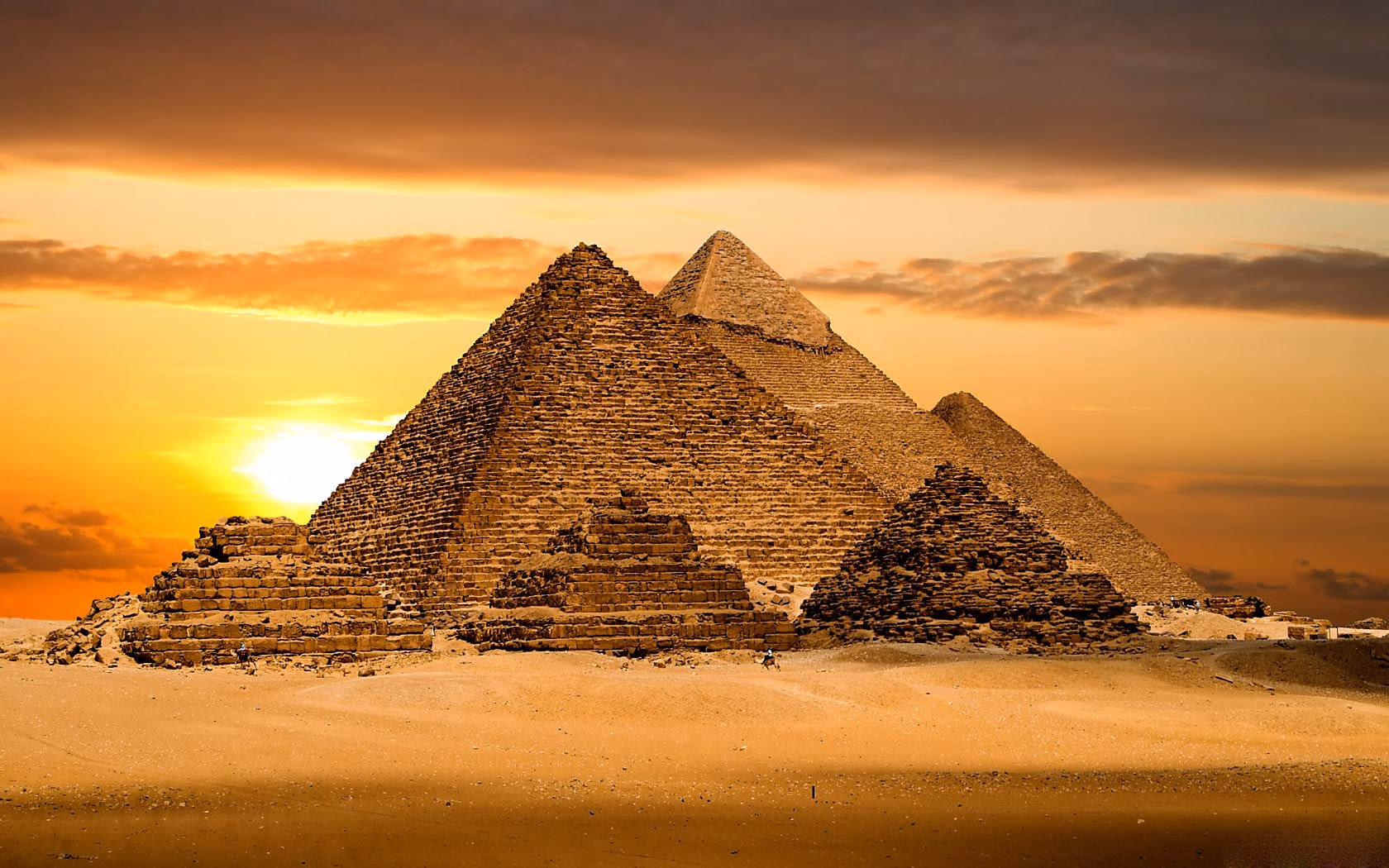 The three pyramids of Giza at golden hour