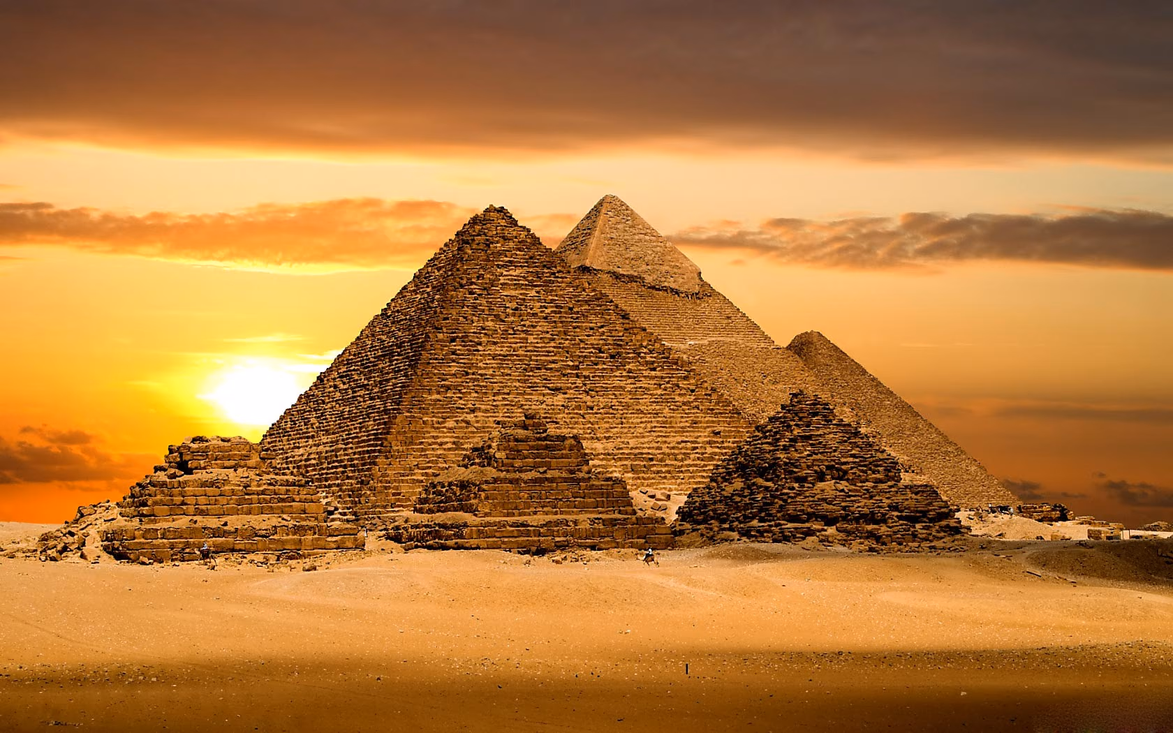 The three pyramids of Giza at golden hour