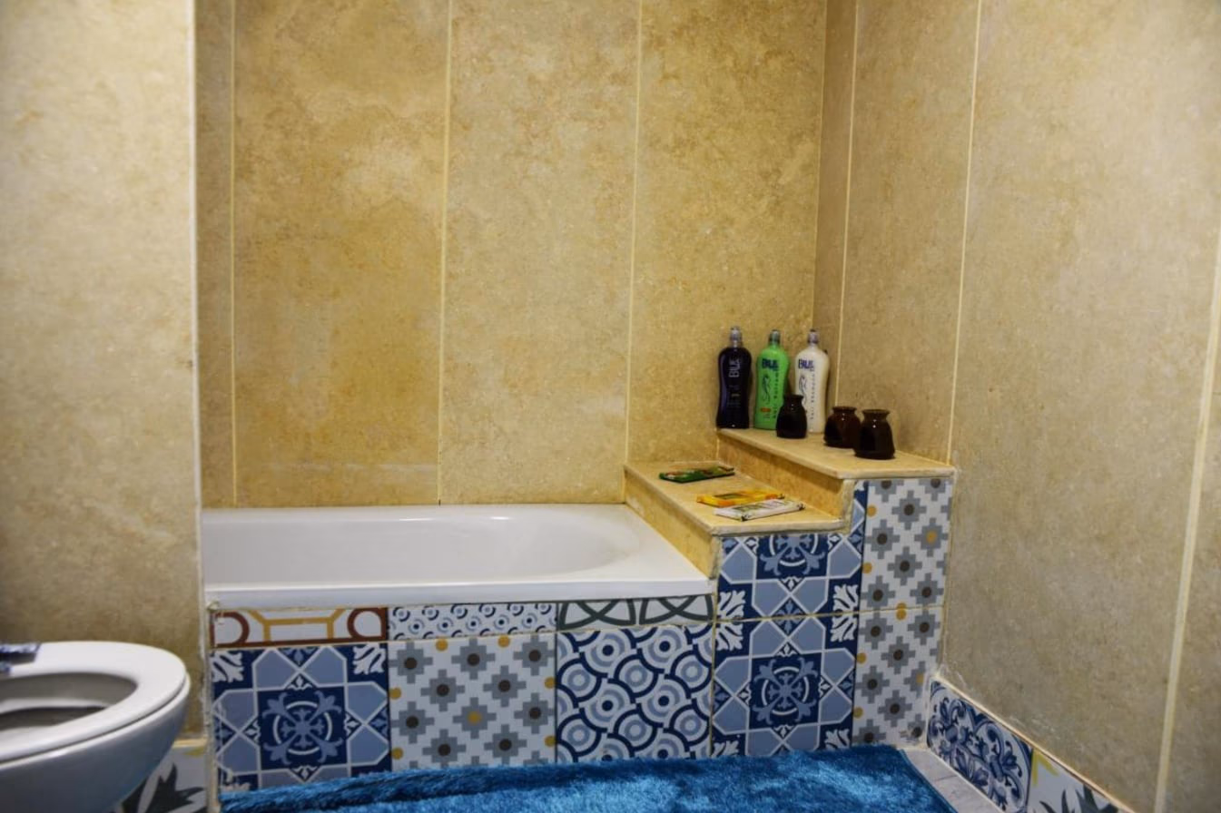 Bathroom with a tiled bathtub