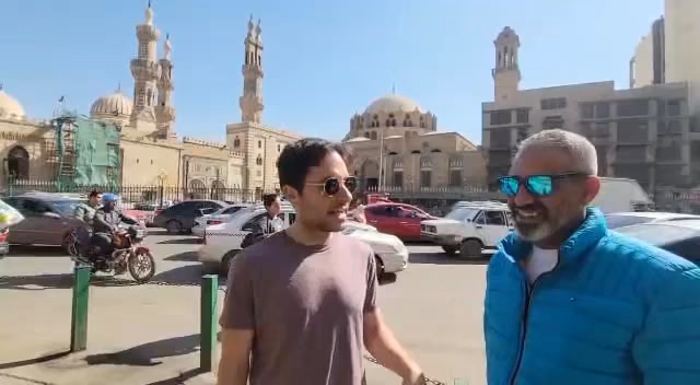 A guest with Rami in front of Al-Hussein Mosque